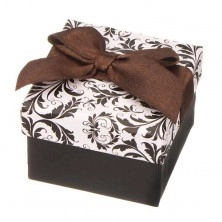 Black and white jewellery gift box with ornaments and brown ribbon