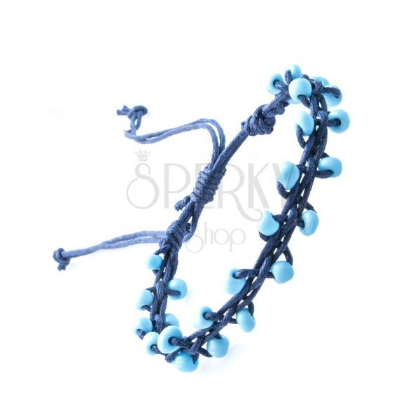 Bracelet of dark blue string decorated with beads