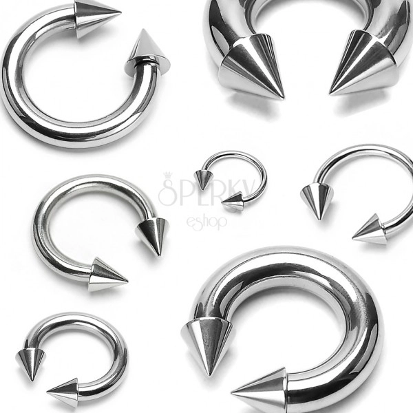 Stainless steel piercing of silver colour - horseshoe finished with pikes