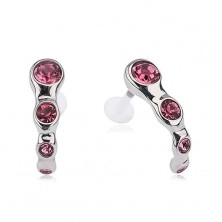 Tragus piercing made of steel, pink zircons