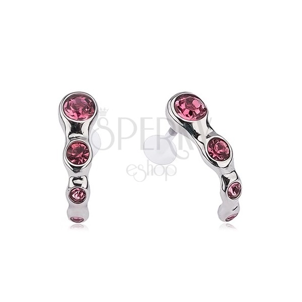 Tragus piercing made of steel, pink zircons