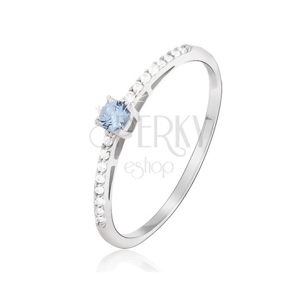Ring made of white gold - shiny, tiny clear zircons, blue topaz gemstone