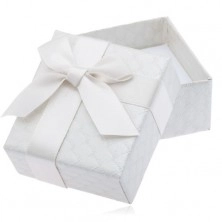 Creamy patterned gift box with bow and ribbon