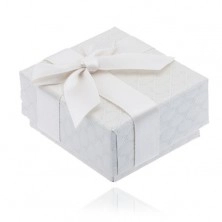 Creamy patterned gift box with bow and ribbon