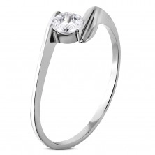 Steel engagement ring with a zircon gripped between the ends of the shoulders
