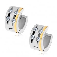 Steel earrings with four clear zircons in notches and stripe of gold colour