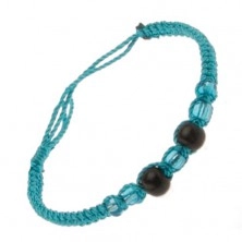 Bracelet made of azure blue strings, black balls, beads