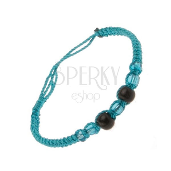 Bracelet made of azure blue strings, black balls, beads