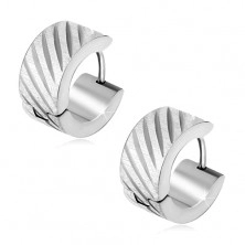 Huggie earrings made of steel, satin surface, shiny diagonal grooves