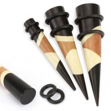 Wooden ear taper in black and brown colour, organic material, rubber bands