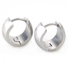 Wider round earrings made of steel in silver colour, mirror-like gloss