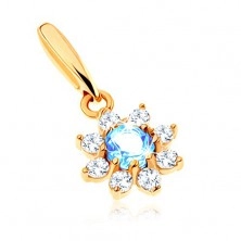 Pendant made of yellow 9K gold - flower with blue topaz, clear zircon petals