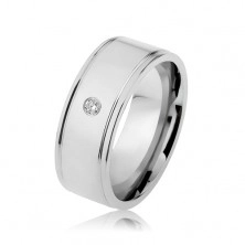 Steel ring in silver colour, mirror-like gloss, clear zircon, notches along edges