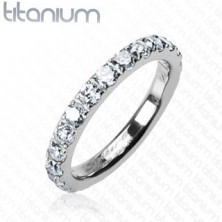 Titanium ring with embedded clear zircons