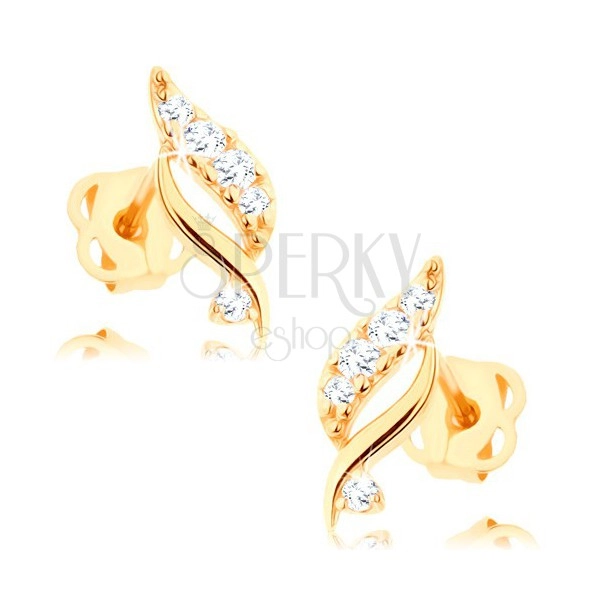 Earrings made of yellow 14K gold - shimmering leaf adorned with clear zircons
