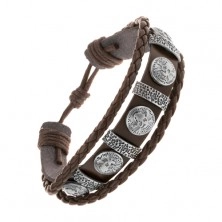 Bracelet made of dark brown synthetic leather, steel ovals and circles with skulls