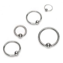 Piercing made of surgical steel - shiny circle with ball, silver colour