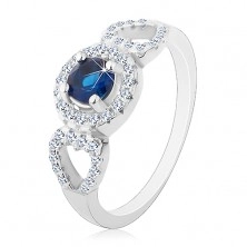 Ring made of 925 silver, round blue zircon, glossy heart contour on the sides
