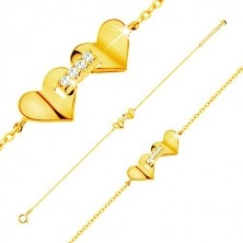 Bracelet made of yellow 14K gold - hearts joined with strip of zircons, thin chain
