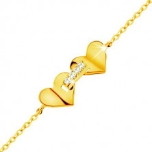 Bracelet made of yellow 14K gold - hearts joined with strip of zircons, thin chain