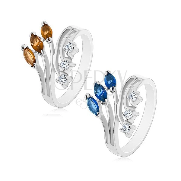 Ring in silver colour with split shoulders, clear and coloured zircons