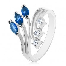 Ring in silver colour with split shoulders, clear and coloured zircons