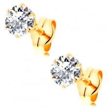 Earrings made of yellow 14K gold - clear round zircon in mount, 4 mm
