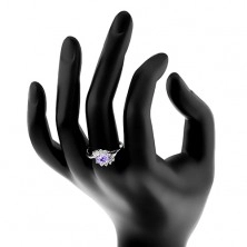 Ring with split shoulders, arcs composed of clear zircons, coloured zircon oval