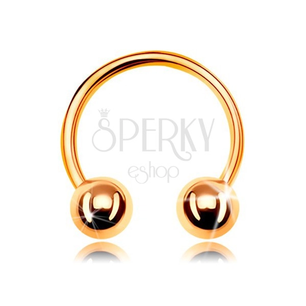 Piercing made of yellow 585 gold, shiny horseshoe ending in two balls