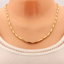Chain made of surgical steel of gold colour, bevelled beams with notches, 3 mm