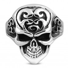 Massive ring made of 316L steel, skull with ornaments on forehead, black patina