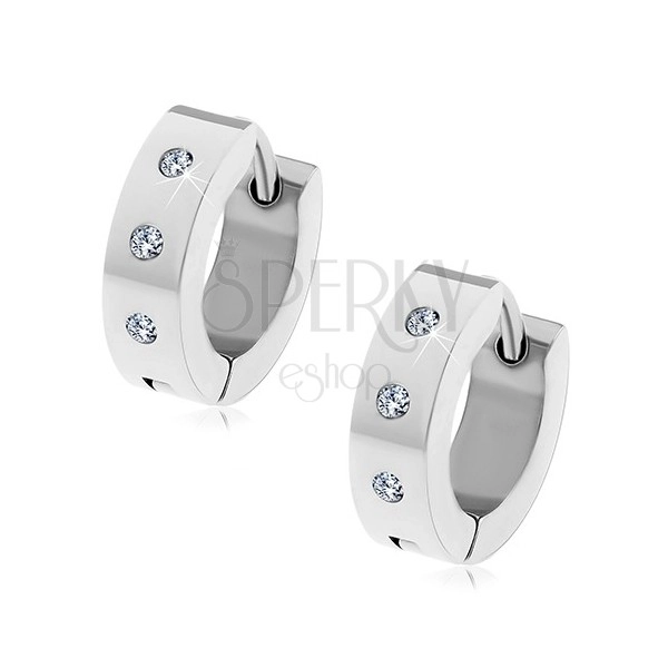 Steel hinged snap earrings in silver colour, three clear round zircons