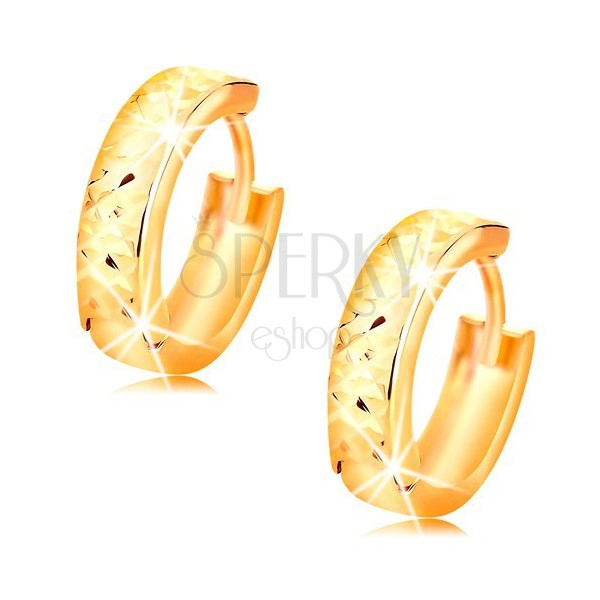 Round 14K gold earrings with cut shimmering surface, high gloss