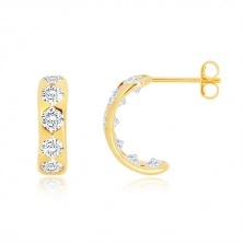 Earrings made of yellow 14K gold - arc with round cutouts and clear zircons