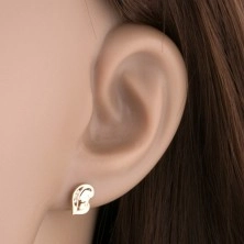 Diamond earrings made of yellow 14K gold - heart composed of two faces, clear brilliants