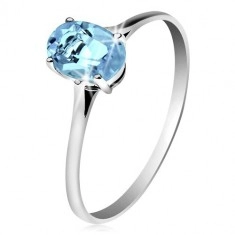 585 gold ring with oval glistening topaz in blue colour, thin shoulders