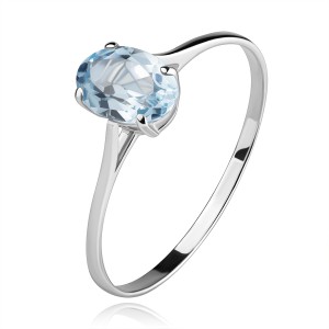 585 gold ring with oval glistening topaz in blue colour, thin shoulders