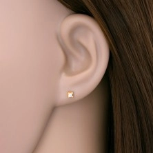 Earrings made of yellow 14K gold - round clear zircon in angular mount, 2 mm