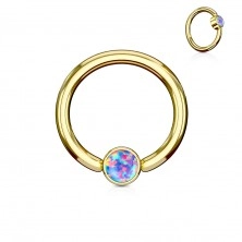 Piercing made of 316L steel, shiny circle in gold colour with synthetic opal
