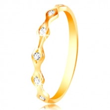 Ring of yellow 14K gold - shiny grains with imbedded zircons of clear colour