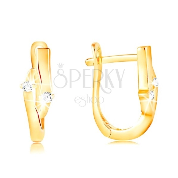 Earrings made of yellow 14K gold - grain with an indent and two clear zircons