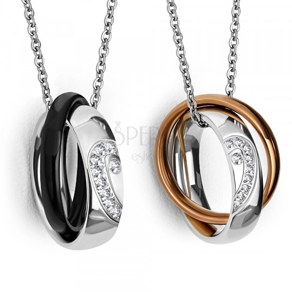 Two steel pendants – shiny rings with, halved heart,thinner colorful rings