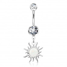 A steel belly button piercing in silver hue – glittery zircon, the sun