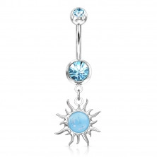 A steel belly button piercing in silver hue – glittery zircon, the sun