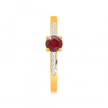 Ring made of 14K yellow gold – radiant round ruby in a mount, zircon strips