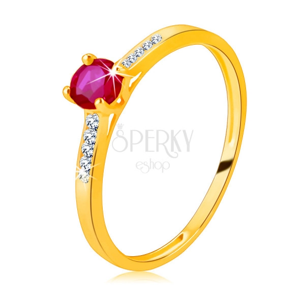 Ring made of 14K yellow gold – radiant round ruby in a mount, zircon strips