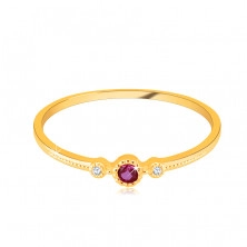 Diamond ring in 14K yellow gold – ruby in a bezel, clear brilliants, tiny beads