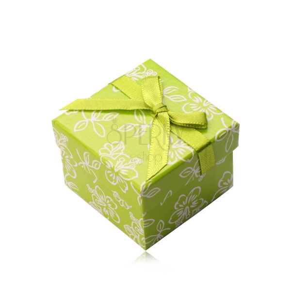 Paper gift box in light green hue, a green ribbon with a bowknot, flowers