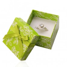 Paper gift box in light green hue, a green ribbon with a bowknot, flowers