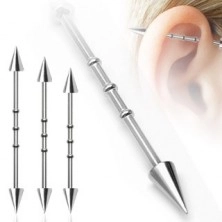 Industrial ear piercing with three rings and spiky heads